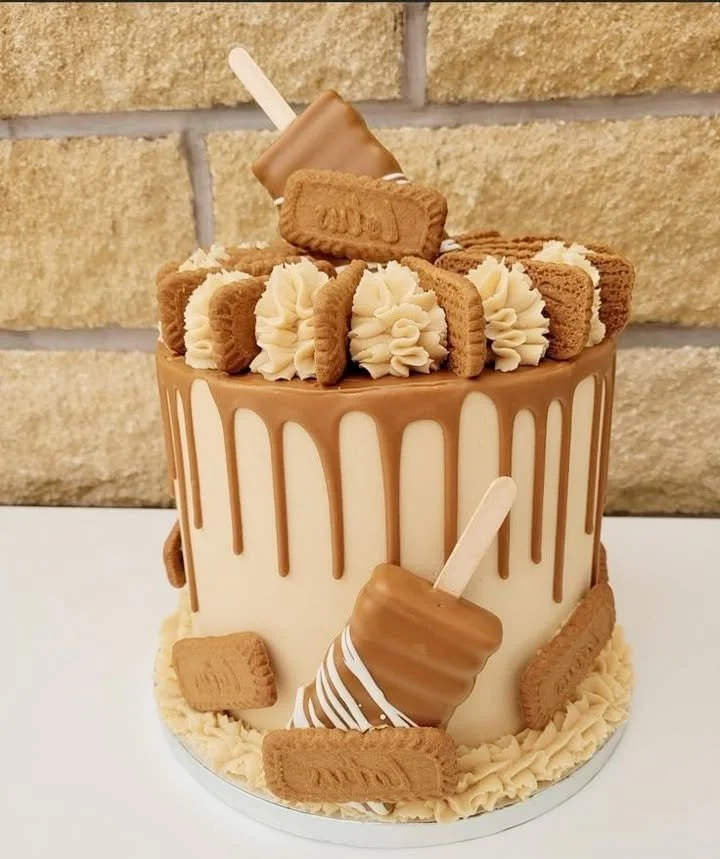 Homemade Lotus Biscoff drip cake with caramel drizzle and Biscoff biscuit toppings