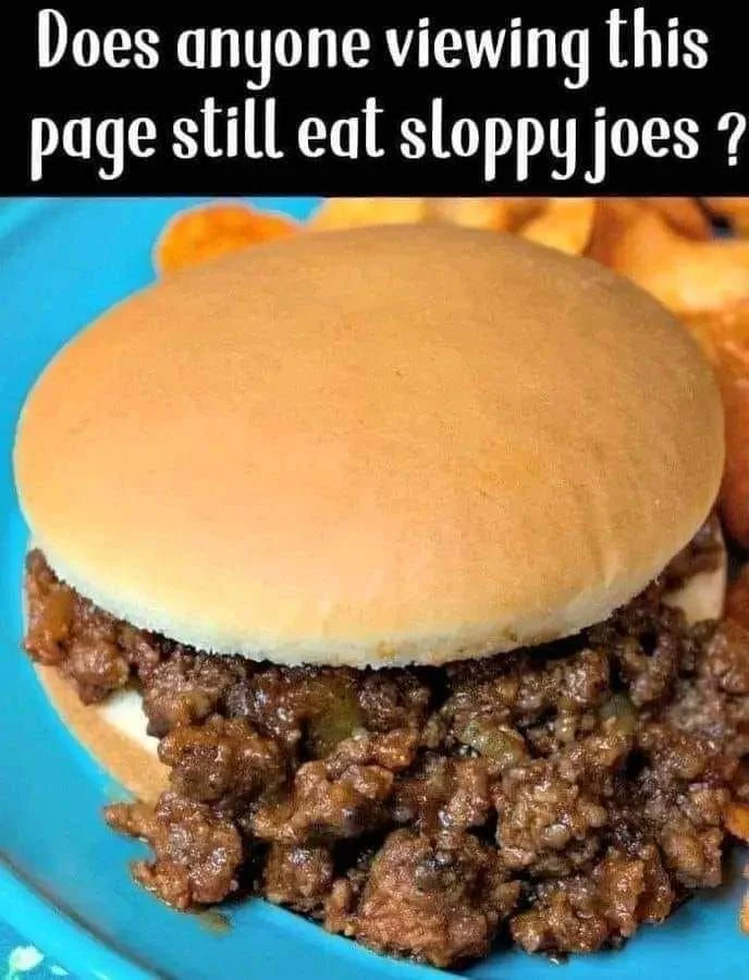 Delicious homemade Sloppy Joes served on a plate with toppings.
