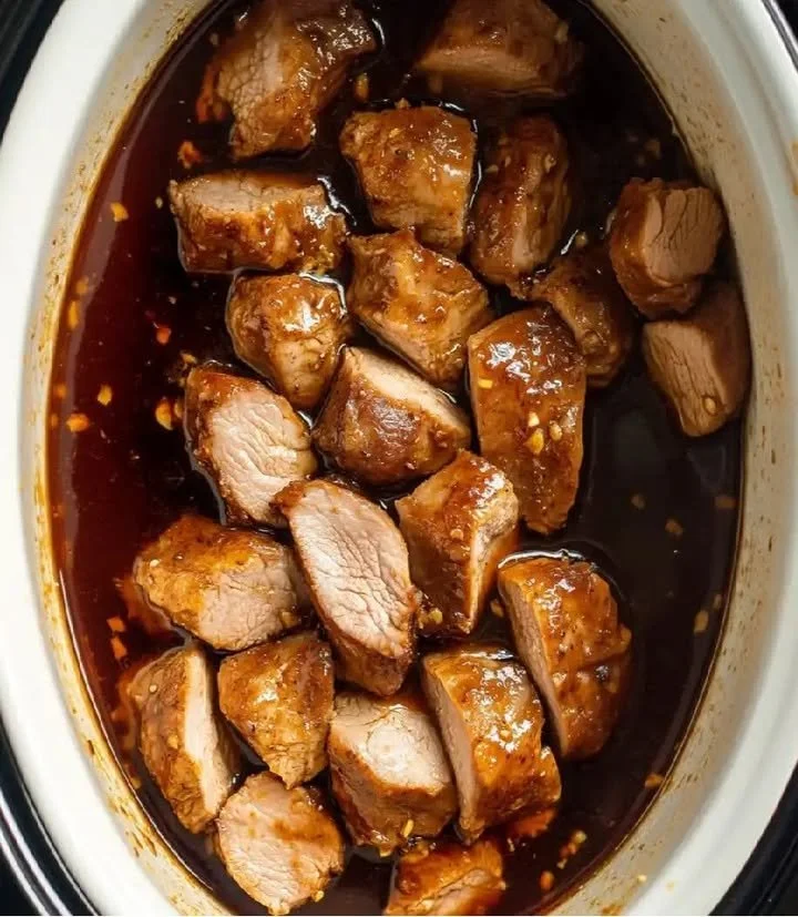 Honey Garlic Pork Tenderloin served with vegetables on a plate
