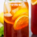 A glass of refreshing iced tea with lemon and mint
