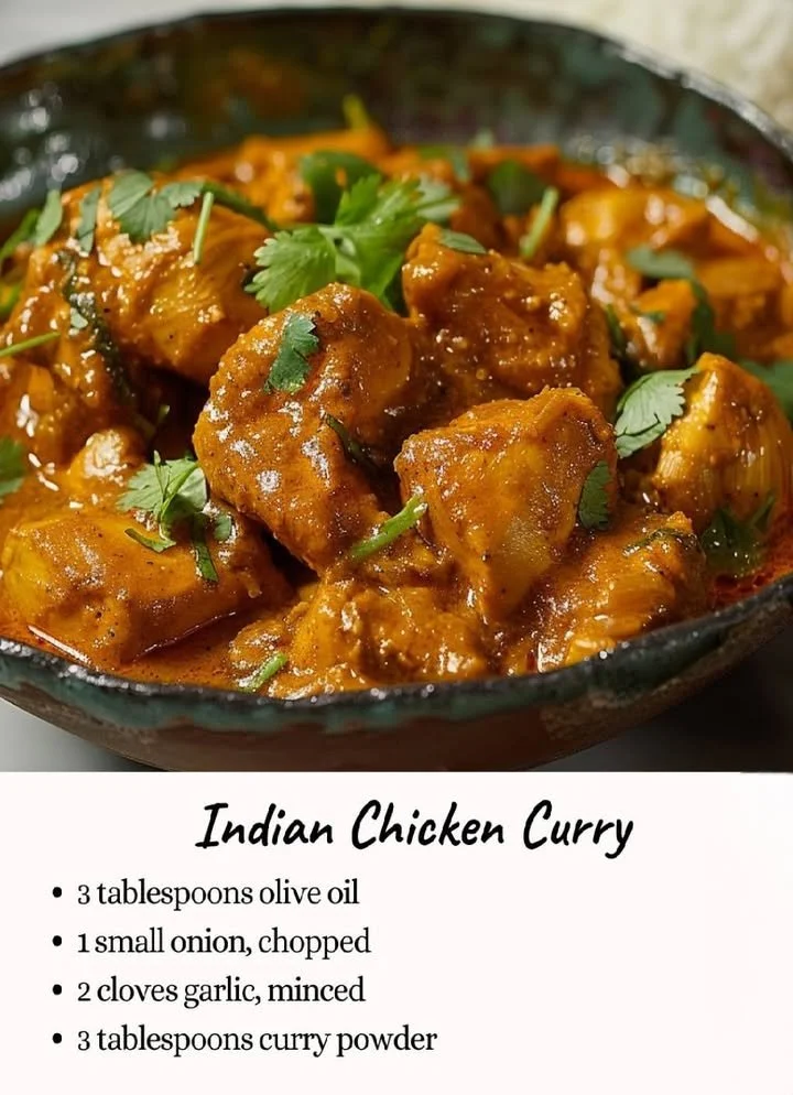 Bowl of Indian Chicken Curry served with rice and garnish