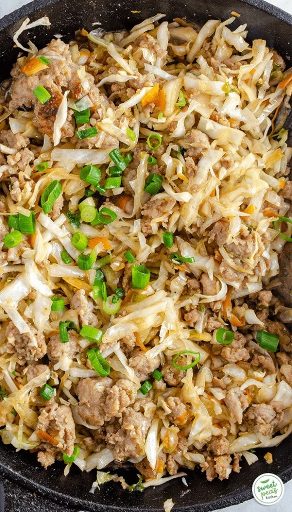 Keto Egg Roll in a Bowl with fresh vegetables and protein topping