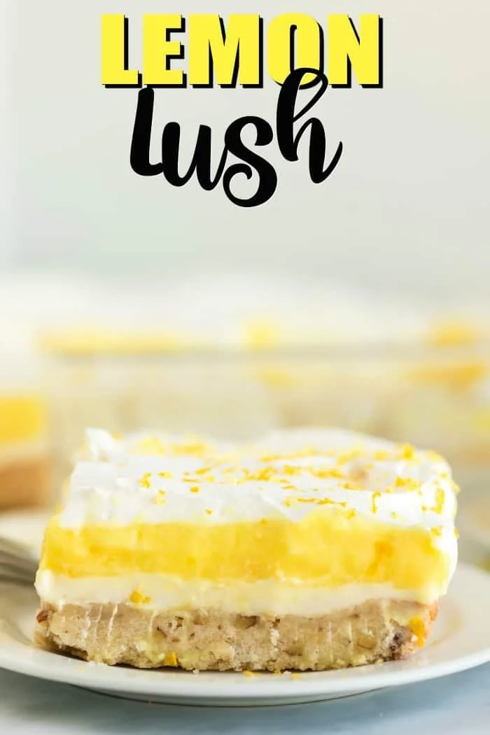 Delicious Lemon Lush dessert topped with whipped cream and lemon zest