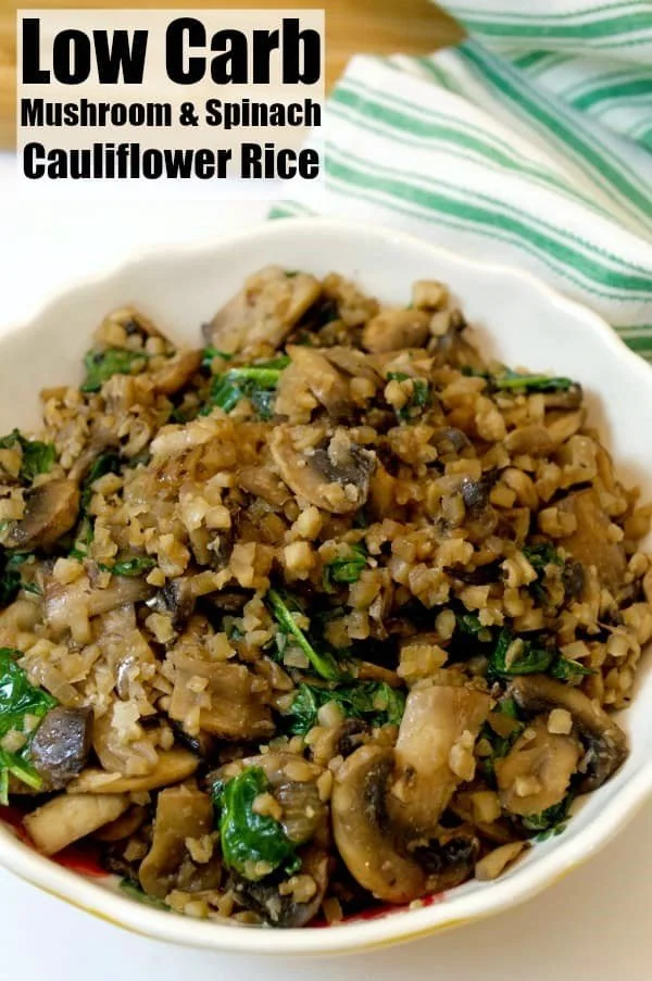 Bowl of low carb mushroom spinach cauliflower rice garnished with herbs