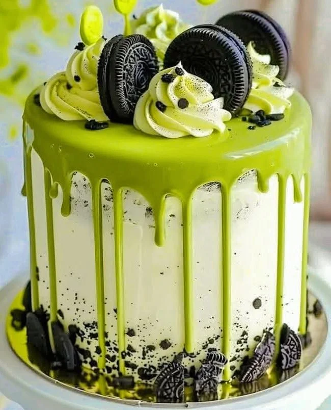 Delicious Matcha Oreo Drip Cake with green matcha frosting and Oreo cookie drizzle.