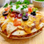 Delicious homemade Mexican pizza topped with fresh ingredients.