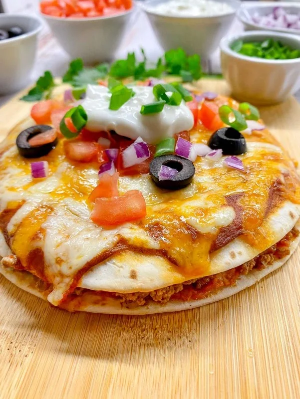 Delicious homemade Mexican pizza topped with fresh ingredients.