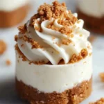 Mini Biscoff cheesecakes topped with crushed Biscoff cookies