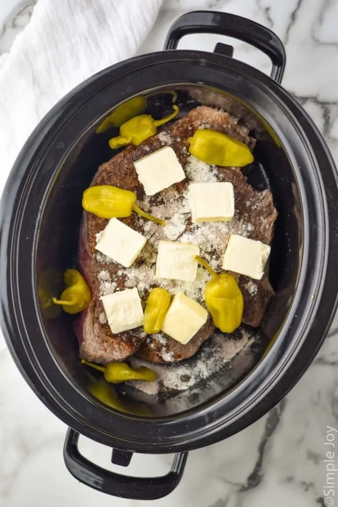 Delicious Mississippi Pot Roast served with vegetables and gravy