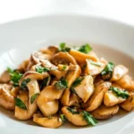 Sautéed mushrooms with herbs in a stylish mushroom pan