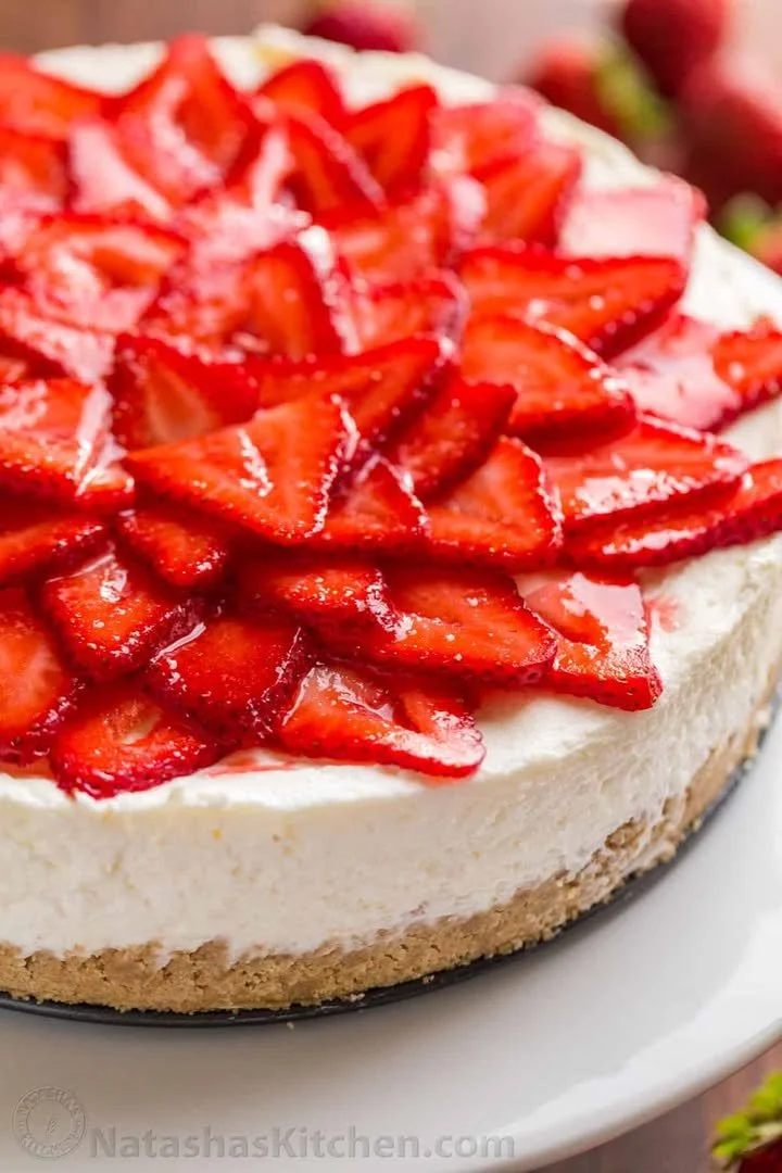 Delicious no-bake cheesecake topped with fresh berries and whipped cream