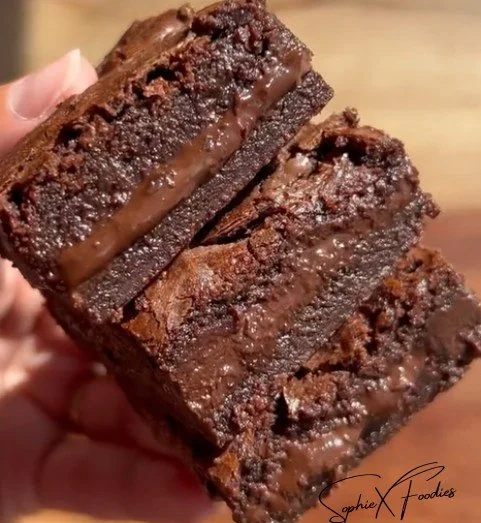 Delicious homemade Nutella brownies topped with chocolate drizzles
