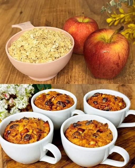 Warm mug of oatmeal with fresh apple slices and cinnamon on top