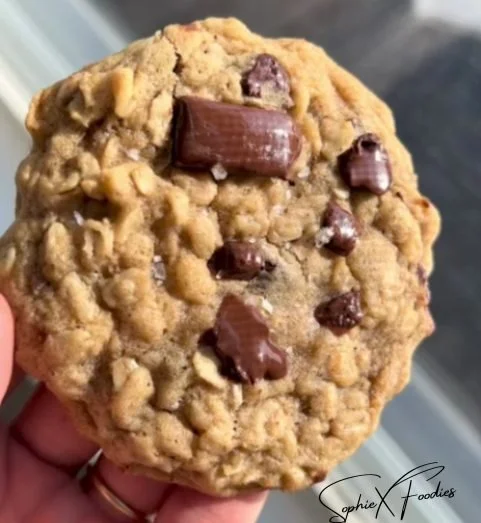 Freshly baked oatmeal cookies on a cooling rack