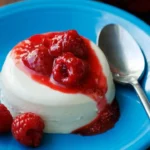 Delicious homemade Panna Cotta topped with berries on a stylish dessert plate