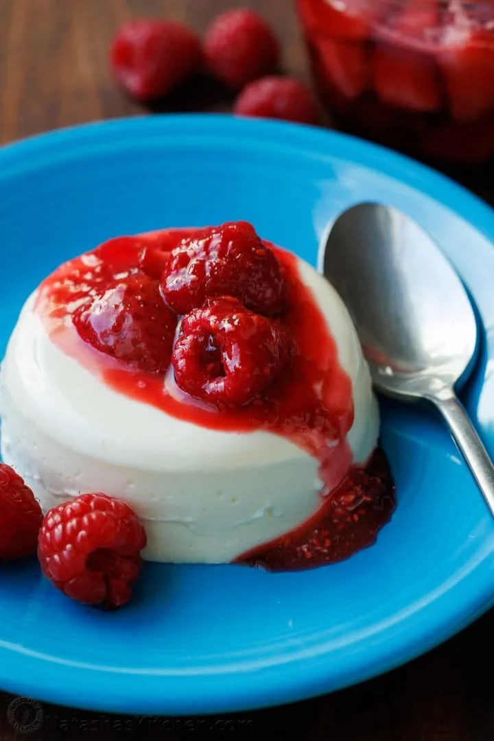 Delicious homemade Panna Cotta topped with berries on a stylish dessert plate