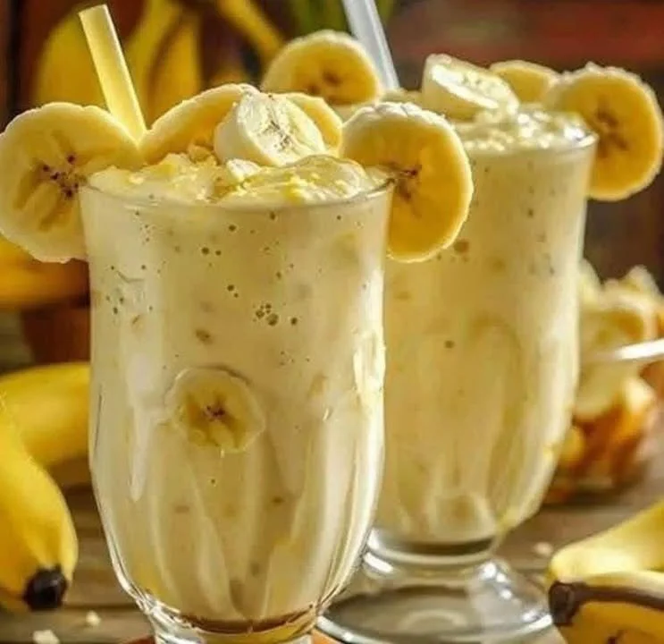 Pineapple banana smoothie in a glass with fresh fruits