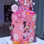 Pink Minnie Mouse cake for baby girl's first birthday celebration