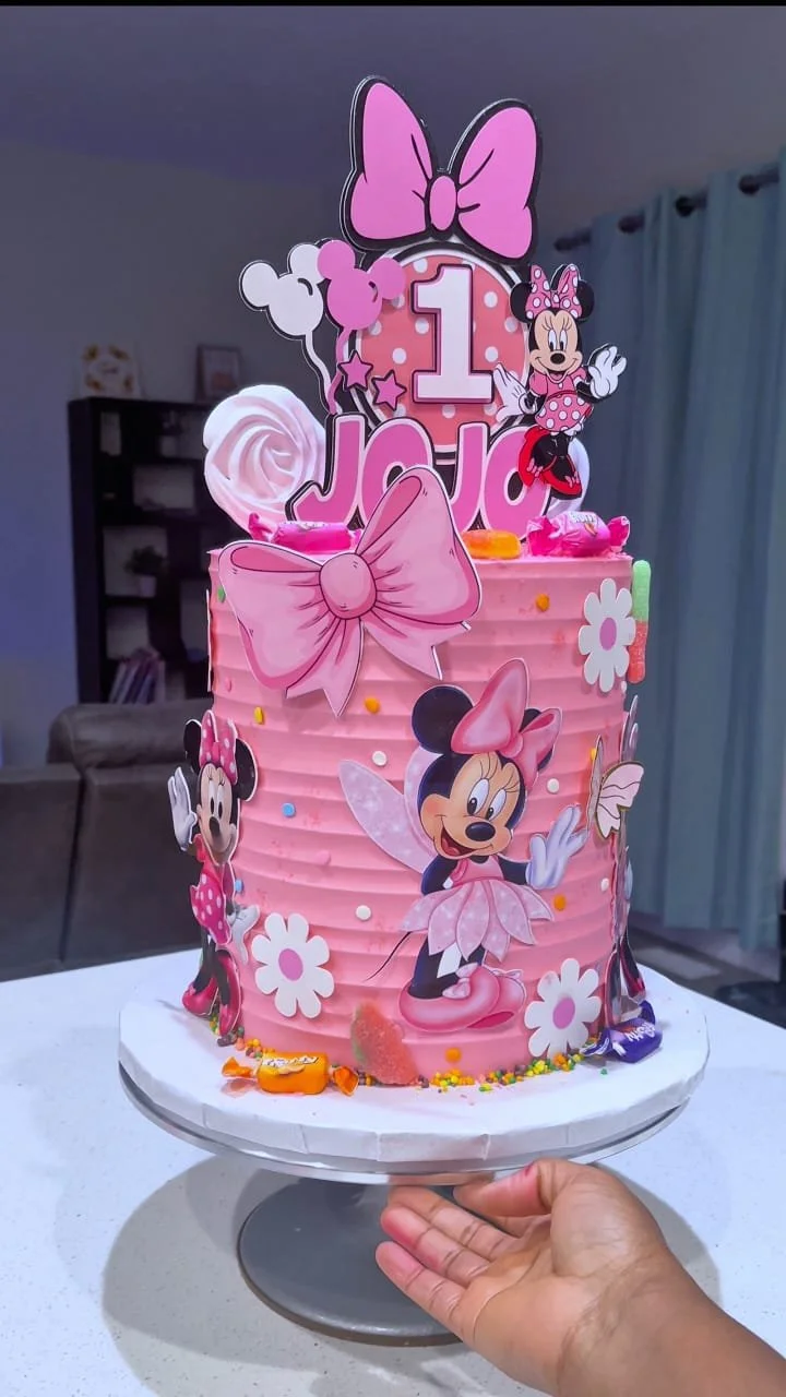 Pink Minnie Mouse cake for baby girl's first birthday celebration