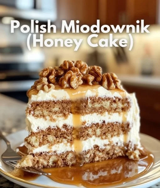 Slice of Polish Honey Cake topped with honey and nuts
