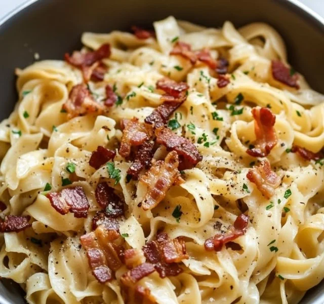 Plate of traditional Polish noodles with sauce and herbs