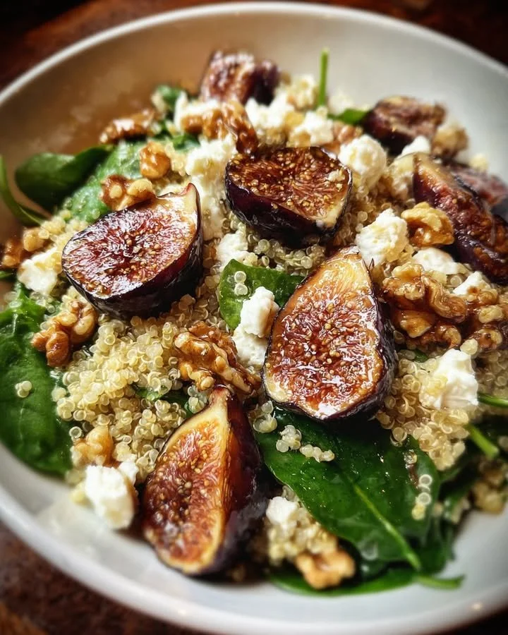 Roasted Fig and Goat Cheese Quinoa Salad garnished with fresh ingredients