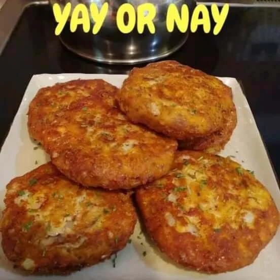 Delicious salmon patties cooked to perfection on a plate