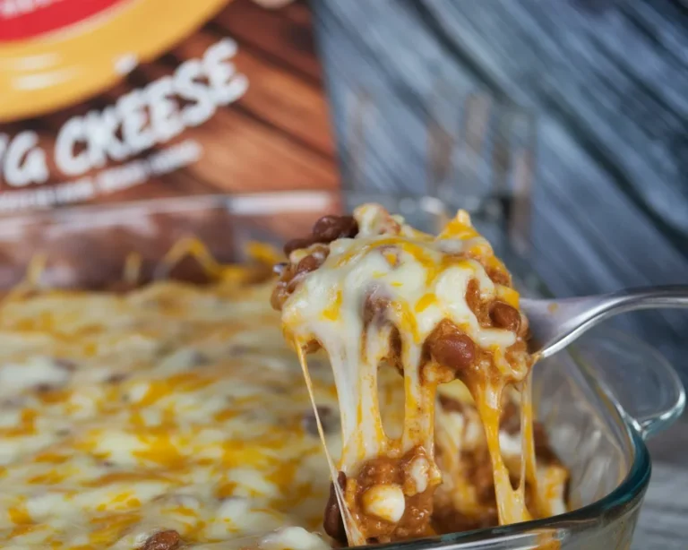 Delicious Walking Taco Bake casserole topped with Fritos and cheese, easy recipe.