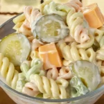 Creamy dill pickle pasta salad featuring rotini pasta, pickles, and a tangy dressing.
