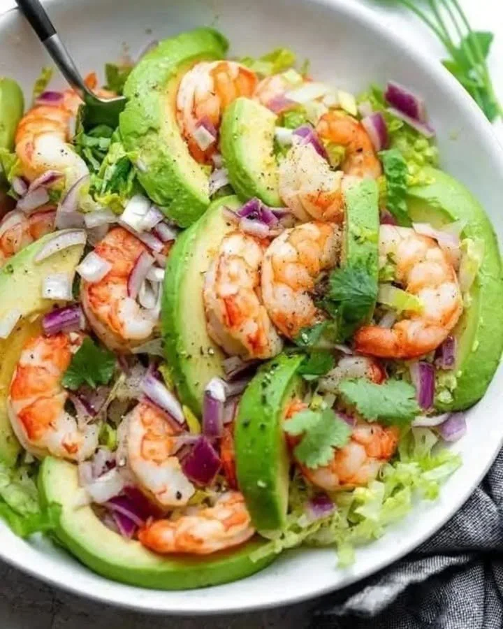 Delicious Shrimp Avocado Salad garnished with fresh ingredients