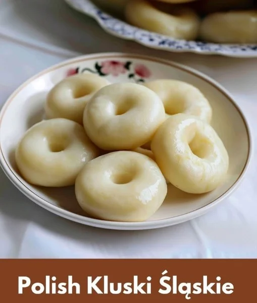Delicious Silesian Dumplings served with sauce and herbs