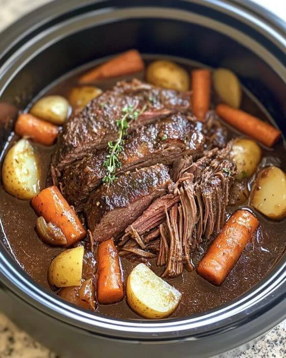 Delicious Slow Cooker Amish Pot Roast served with colorful root vegetables