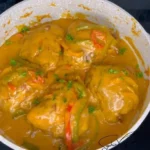 Delicious smothered chicken served with savory gravy and side dishes