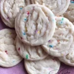 Soft and chewy sugar cookies on a plate, perfect for any dessert occasion.