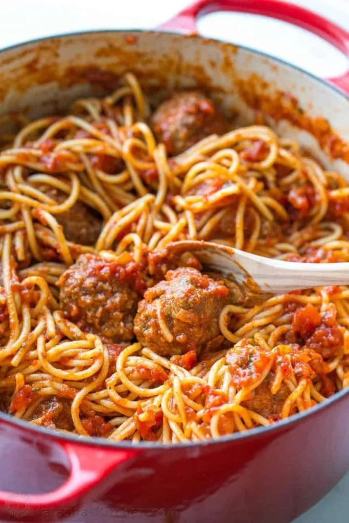 Delicious spaghetti and meatballs served with marinara sauce and Parmesan cheese