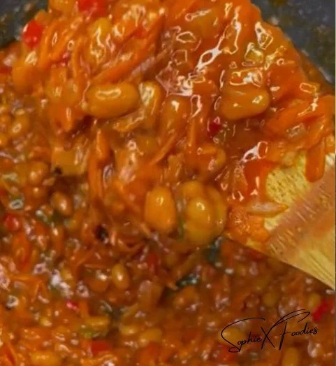 A vibrant bowl of spicy Chakalaka with vegetables and spices