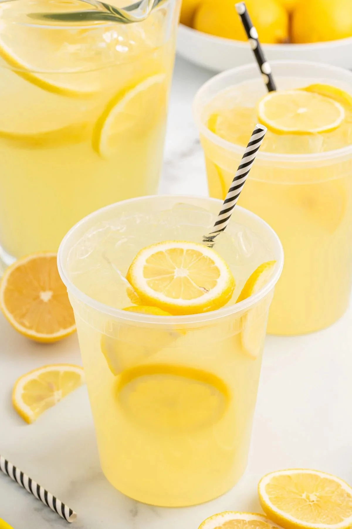 Glass of State Fair Lemonade served with ice and a lemon slice
