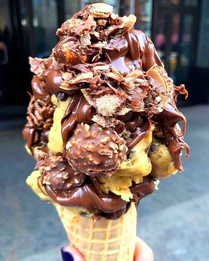 Delicious summer chocolate cookie monster cone with ice cream and chocolate cookies