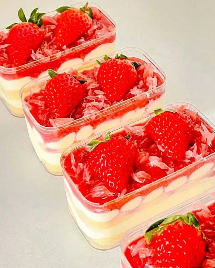 Delicious summer strawberry cream dessert cups topped with fresh strawberries