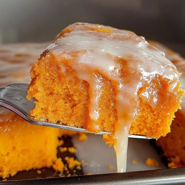 Delicious sweet potato honey bun cake topped with icing and nuts