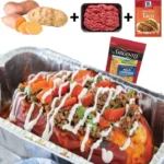 Taco stuffed potatoes topped with cheese and salsa