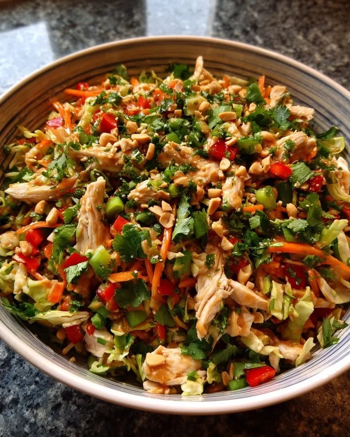 Delicious and colorful Thai Chicken Salad with fresh vegetables and herbs