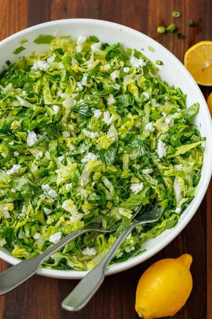 Traditional Greek Lettuce Salad with fresh vegetables and dressing