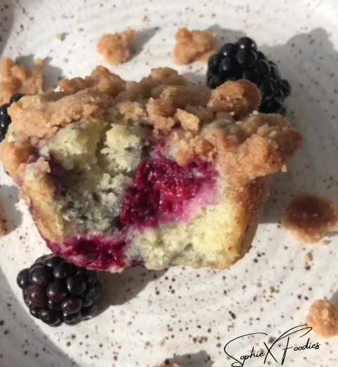 Delicious vegan blackberry muffins cooling on a wire rack.