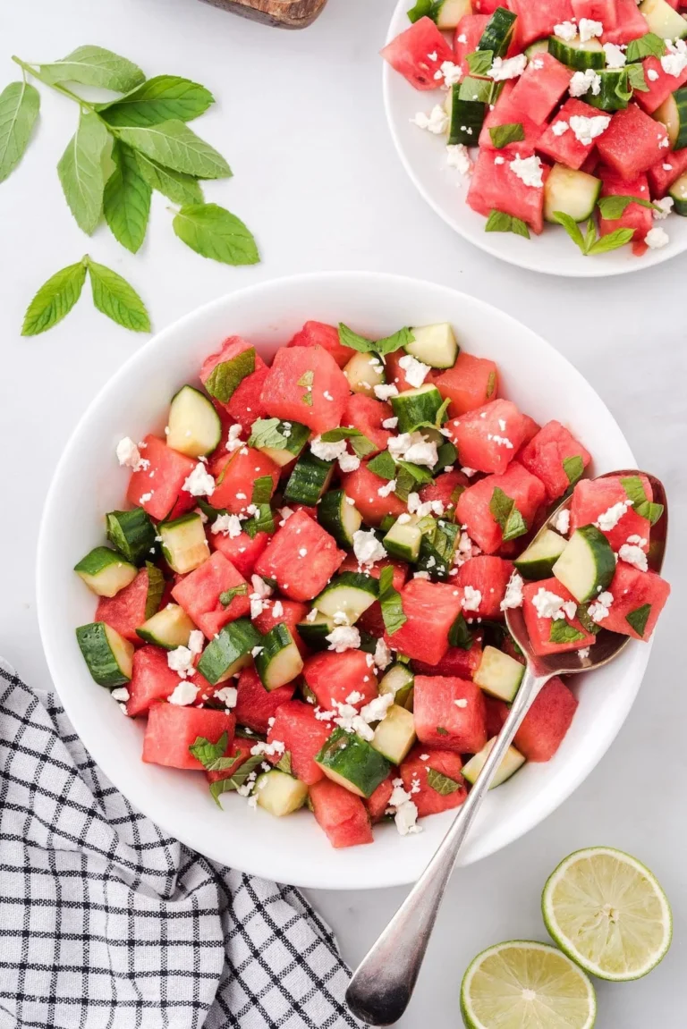 Watermelon and feta salad garnished with mint and served in a bowl