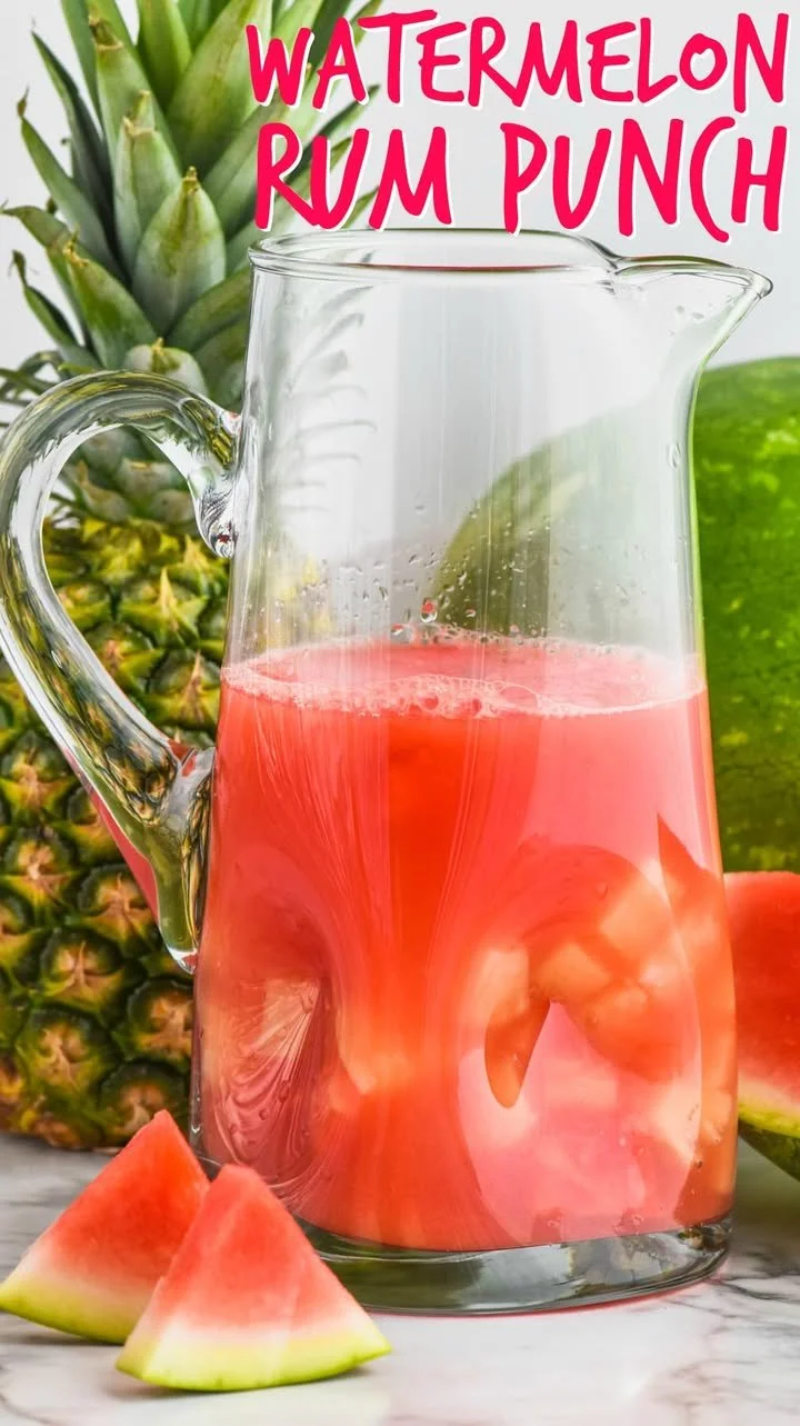 A refreshing glass of Watermelon Rum Punch served with fresh watermelon slices.