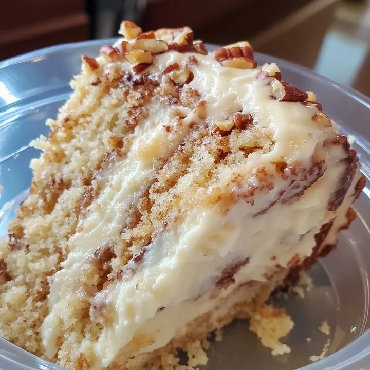 Sliced White German Chocolate Cake topped with coconut and pecans