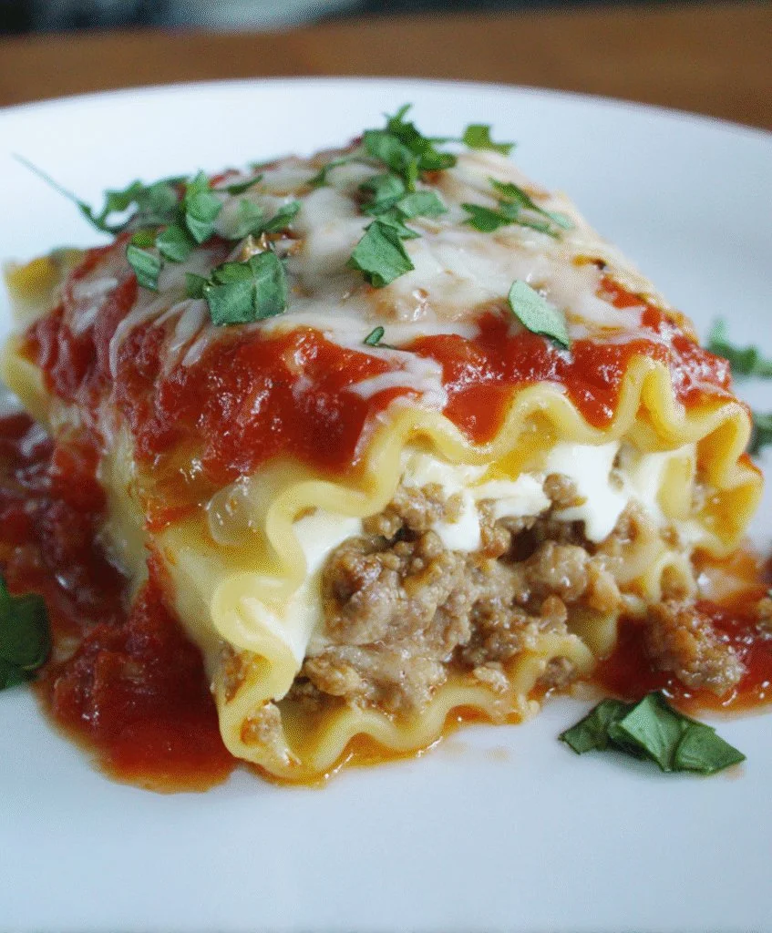 Delicious 3-Cheese Sausage Lasagna Roll-Ups with melted cheese and sausage filling