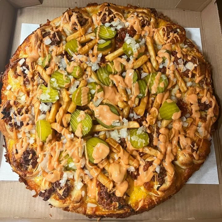 Delicious Bacon Big Mac Pizza topped with cheese and bacon