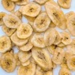 Baked banana chips in a bowl, a healthy and tasty snack option